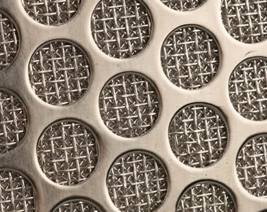 A corner of perforated sintered filter disc.