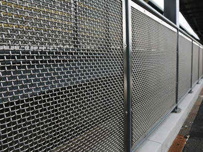 Several pieces of galvanized wire mesh is installed on the metal frame as partition.